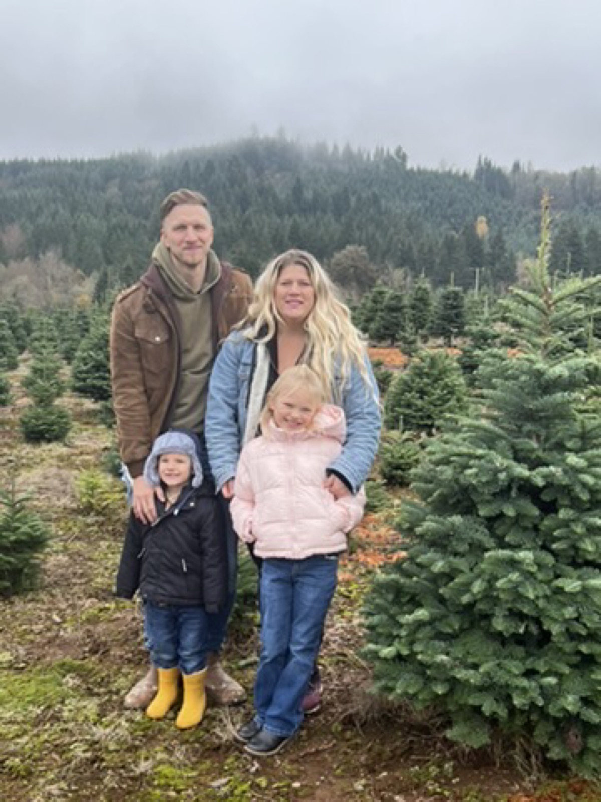The Stone family at a Christmas tree farm